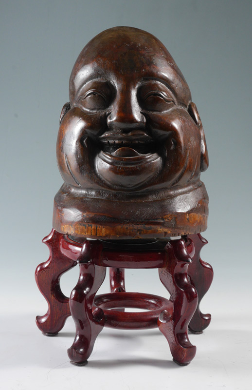 Appraisal: LARGE CARVED WOOD LAUGHING BUDDHA HEAD Chinese carved bust of