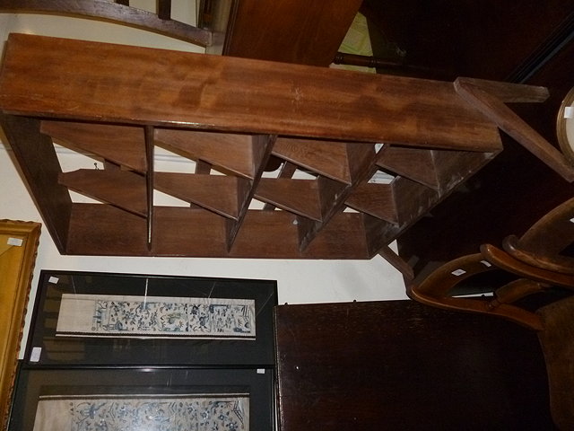 Appraisal: AN UNUSUAL HARDWOOD BOOKCASE on shaped feet cm wide together