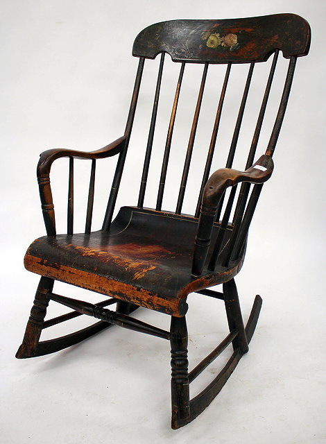 Appraisal: A TH CENTURY PAINTED ROCKING CHAIR with a spindle back