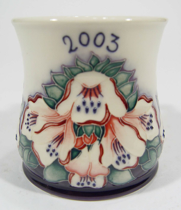 Appraisal: Moorcroft pottery mug hand painted and tubelined with flowers factory