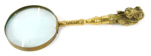 Appraisal: A brass handled magnifying glass cast with a head of