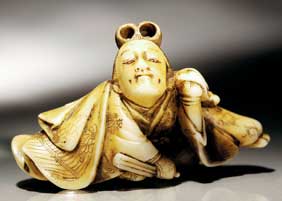 Appraisal: ANTIQUE IVORY NETSUKE Antique carved ivory netsuke of a Kabuki