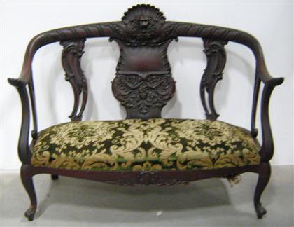 Appraisal: Upholstered settee with carved back late th century H in