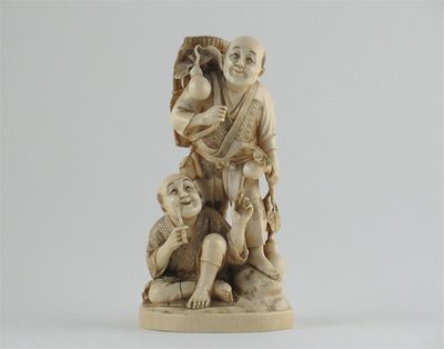 Appraisal: A Japanese ivory carving of two figures one carrying a