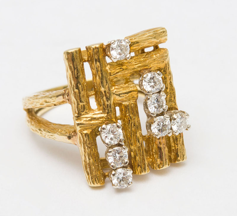 Appraisal: K GOLD AND DIAMOND ABSTRACT RING Set with round diamonds