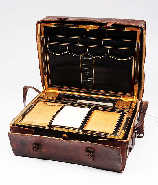 Appraisal: A th Century leather writing boxwith fitted interior retailed by