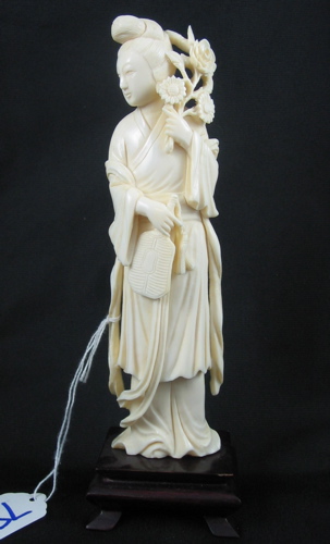 Appraisal: A CHINESE CARVED IVORY FIGURE of a woman in traditional