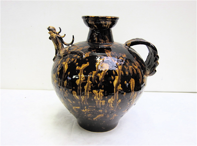 Appraisal: CHINESE CERAMIC BROWN GLAZED EWER JUG having applied leaf handle