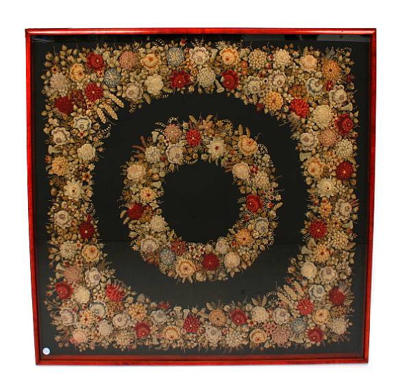 Appraisal: A needlework panel depicting entwined flowers and foliage in a