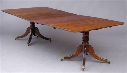 Appraisal: REGENCY MAHOGANY TWO-PEDESTAL DINING TABLE The divided top with reeded