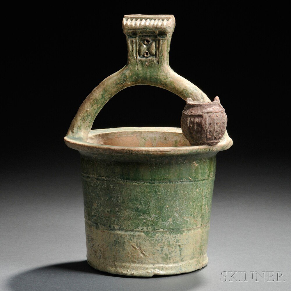 Appraisal: Well-Head and Bucket China Han Dynasty style the roof pulley