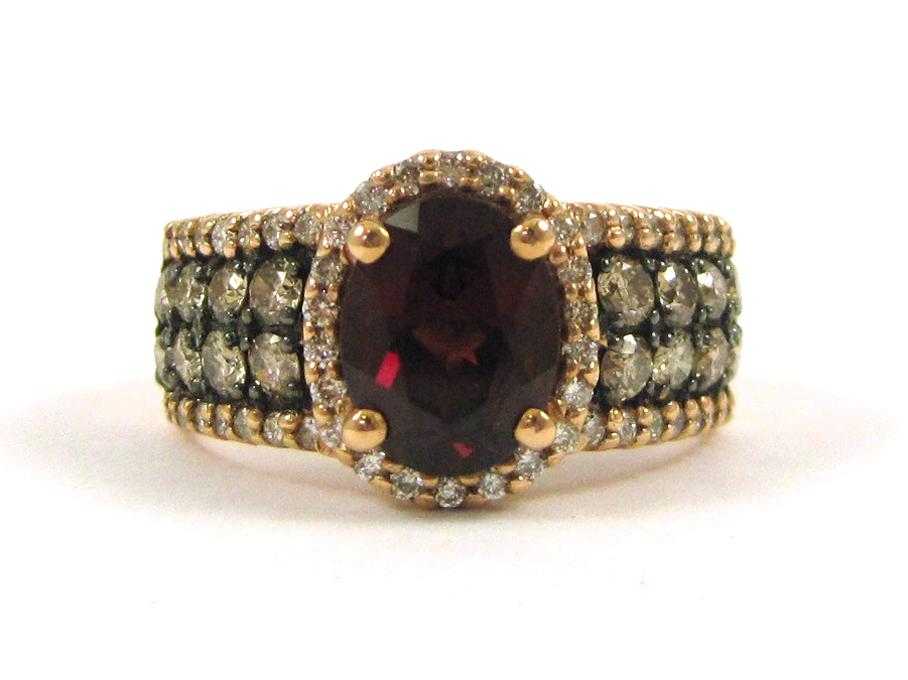 Appraisal: LEVIAN RHODOLITE GARNET AND DIAMOND RING The k rose and