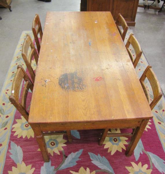 Appraisal: A vintage oak kid's game table and six chairs with