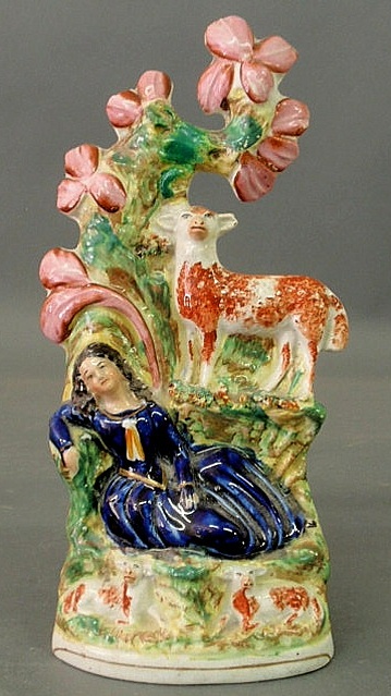 Appraisal: Staffordshire figural group with a woman reclining at the base