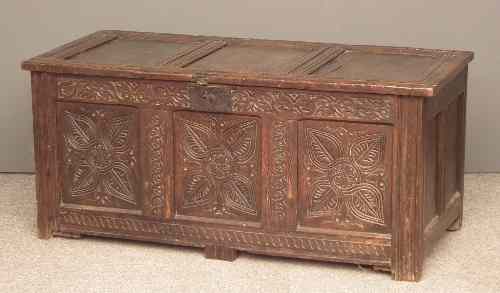 Appraisal: A late th Century panelled oak coffer the three panel