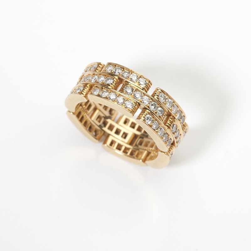 Appraisal: A diamond and gold band Cartier ''Panthere'' Signed Cartier and