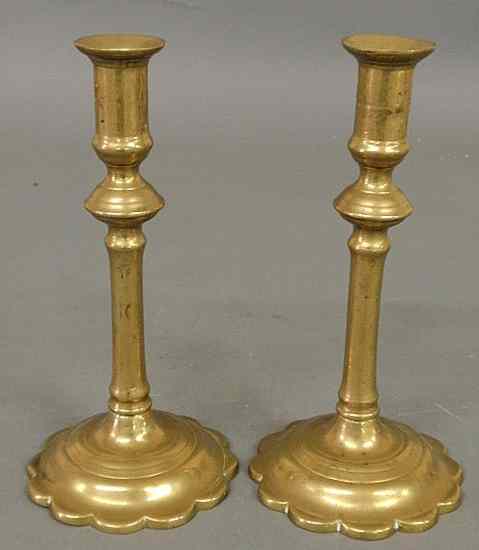 Appraisal: Pair of Queen Anne style brass candlesticks with petal bases