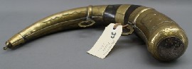 Appraisal: A Moroccan brass and silver moulded powder horn th century