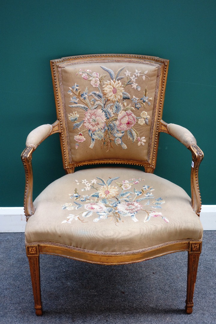 Appraisal: A Louis XVI style gilt framed open armchair with serpentine