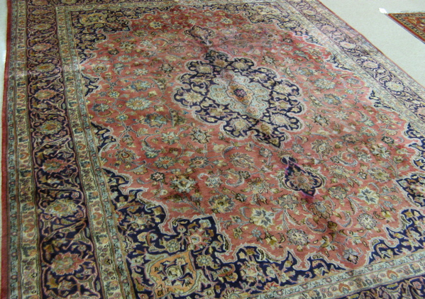 Appraisal: PERSIAN KASHAN CARPET floral and central floral medallion design on