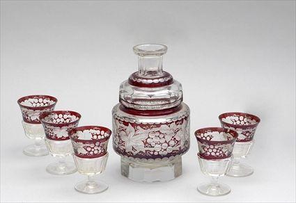 Appraisal: BOHEMIAN CUT RUBY-TO-CLEAR GLASS DECANTER AND FIVE WINESThe cylindrical central