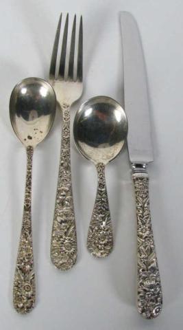 Appraisal: Kirk Sterling Repousse Child's four-piece place setting includes knife fork