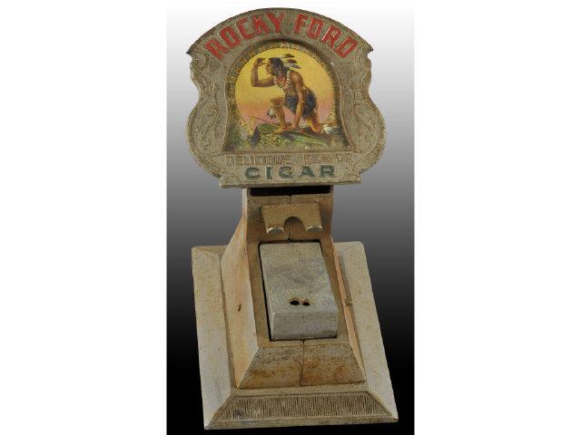 Appraisal: Rocky Ford Cigar Cutter and Match Striker Description Circa Displays