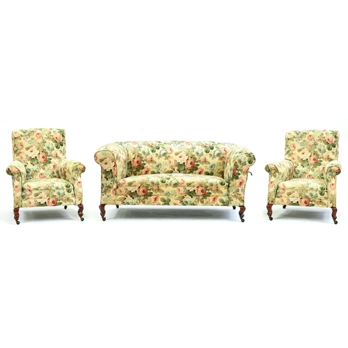 Appraisal: A drop arm Chesterfield sofa and pair of armchairs ensuite