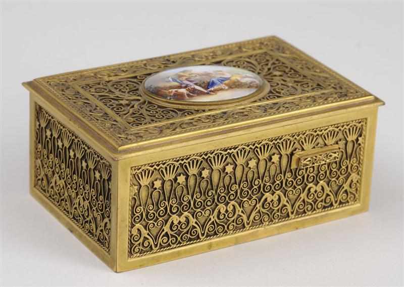 Appraisal: FRENCH GILT-BRONZE ENAMEL BIRD MUSIC BOX The oval hinged lid