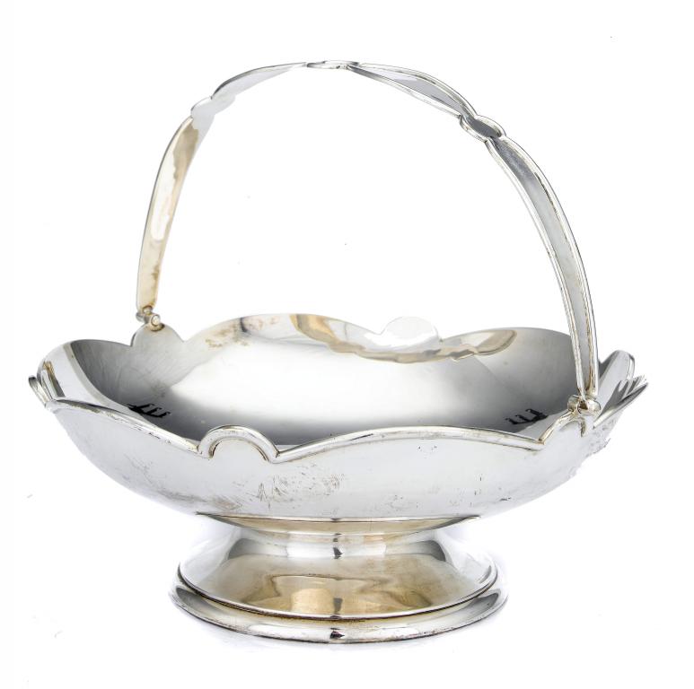 Appraisal: A GEORGE V CAKE BASKET of scalloped circular shape with