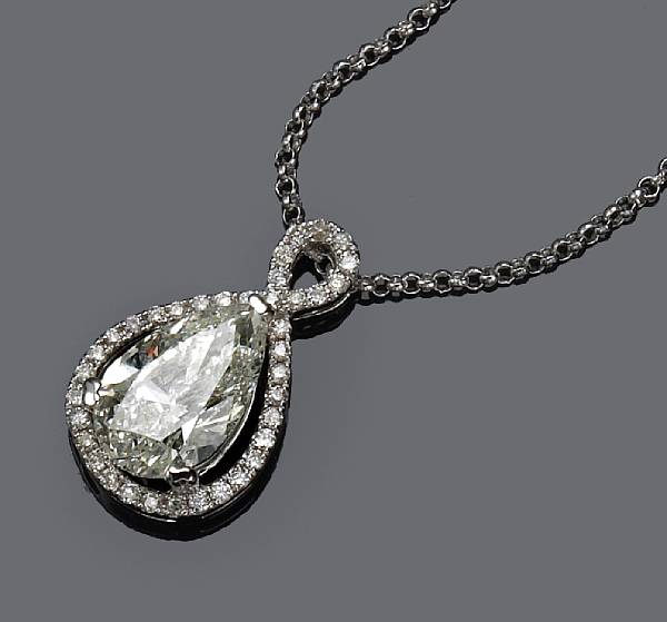 Appraisal: A diamond pendant with chain suspending a pear-shaped diamond weighing