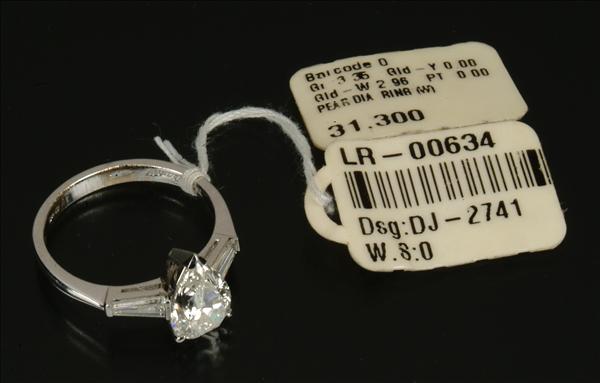 Appraisal: A diamond single stone ring by Dianoor the central pear