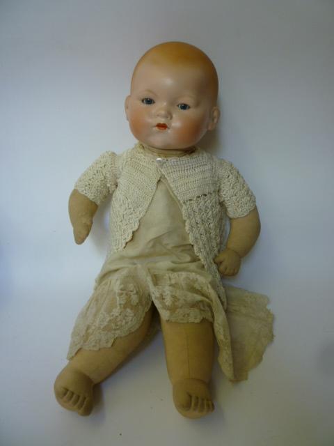 Appraisal: An Armand Marseille bisque head baby doll with blue glass