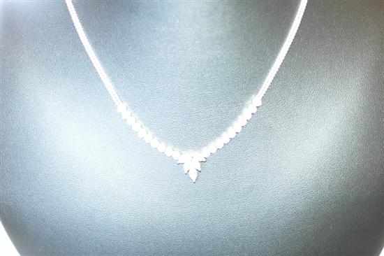 Appraisal: A DIAMOND NECKLACE SET WITH MARQUISE AND ROUND BRILLIANT CUT