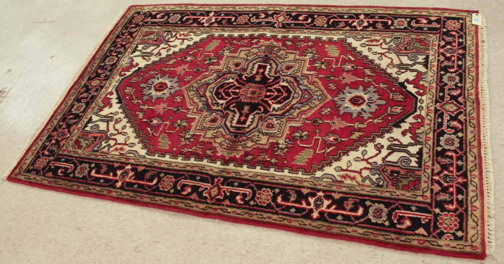 Appraisal: TWO SIMILAR HAND KNOTTED ORIENTAL AREA RUGS Indo-Persian Sarapi design