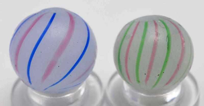 Appraisal: Lot of Clambroth Marbles Description Smaller marble has a white