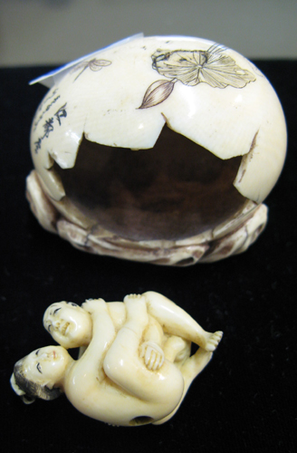 Appraisal: EROTICA A Japanese carved ivory egg having scrimshawed water lilies