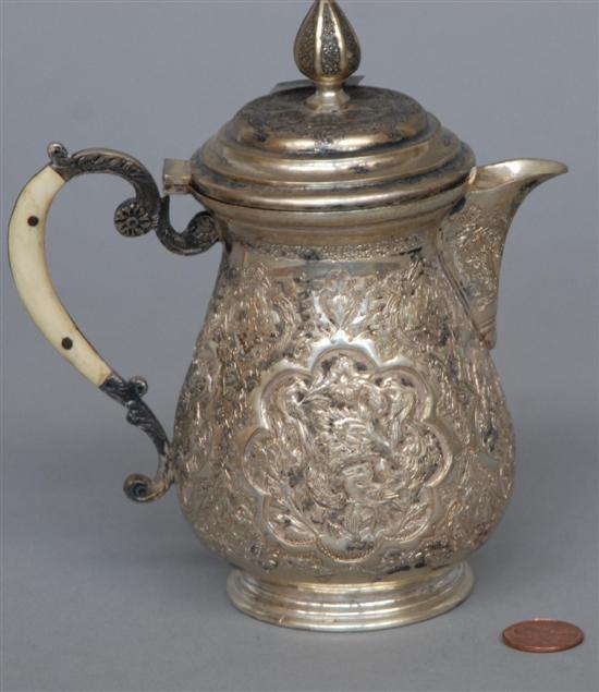 Appraisal: ANTIQUE PERSIAN SILVER Repousse creamer having a hinged top and