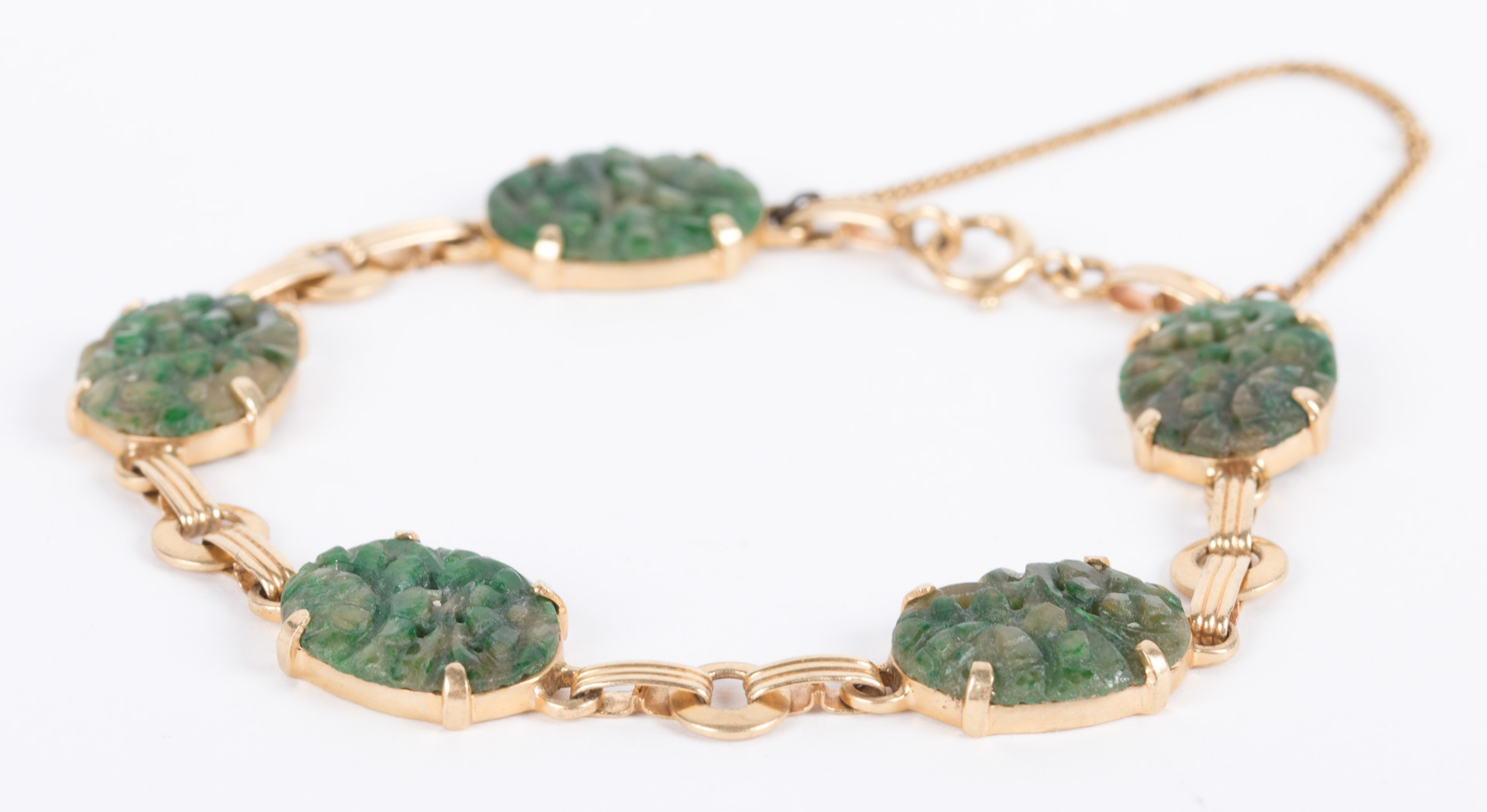 Appraisal: A Jade Gold Bracelet K bracelet with carved green oval