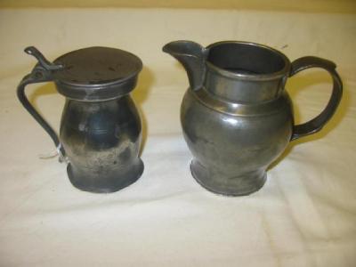 Appraisal: A PEWTER ALE JUG of baluster form with moulded rim