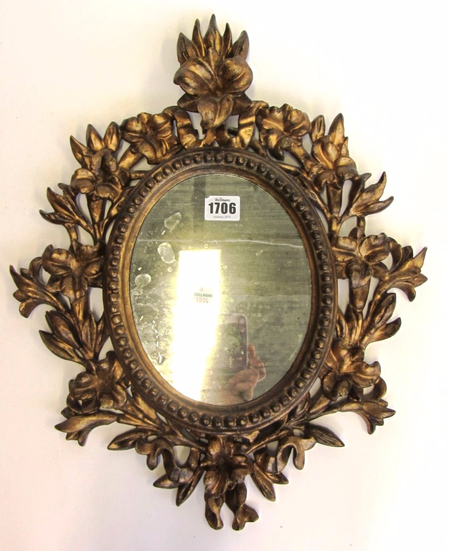 Appraisal: A th century Italian gilt framed oval mirror with floral