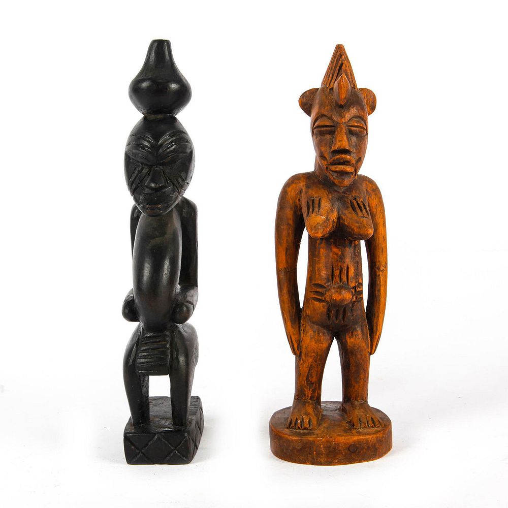 Appraisal: PAIR OF AFRICAN HAND CARVED WOODEN FIGURES Two hand carved