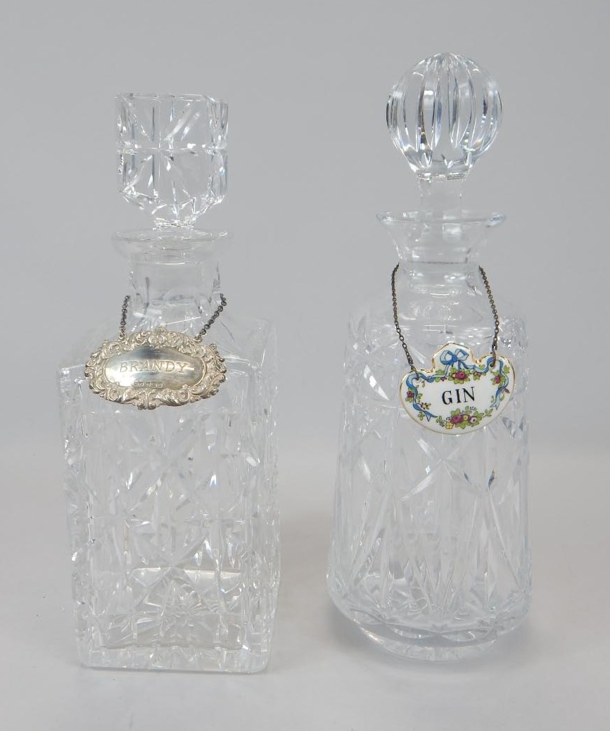 Appraisal: Two cut glass decanters and stoppers one with a silver