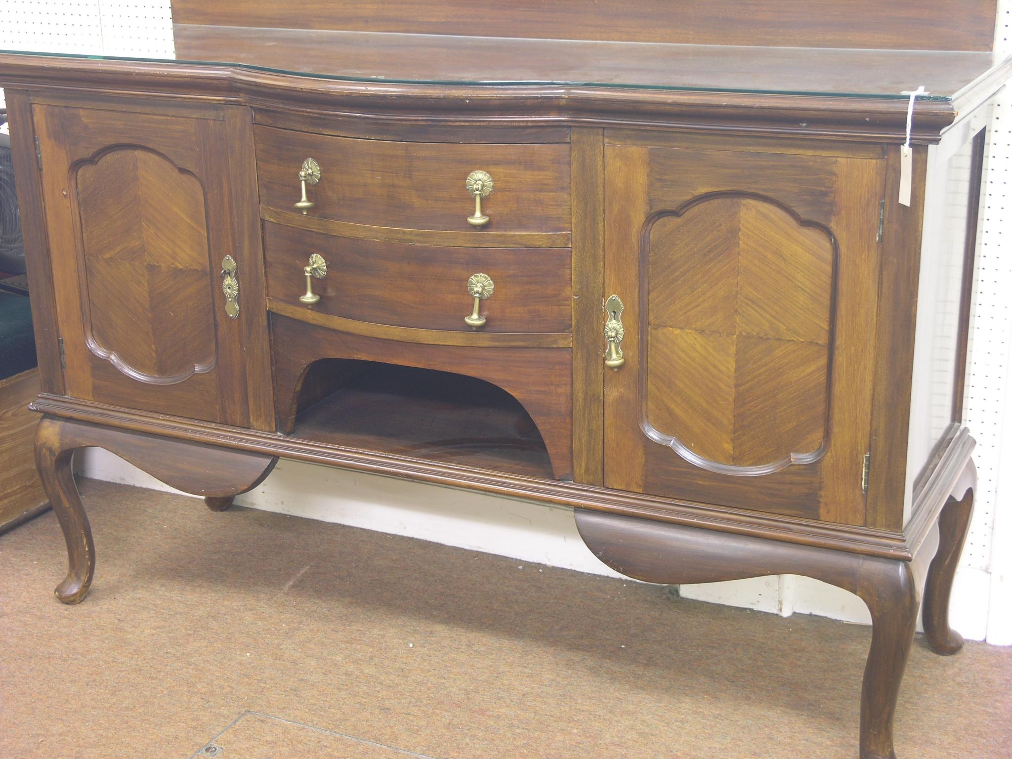 Appraisal: An early th century mahogany sideboard pair of panelled cupboards