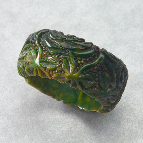 Appraisal: Spectacular green and yellow marbleized Bakelite clamper bracelet entirely carved