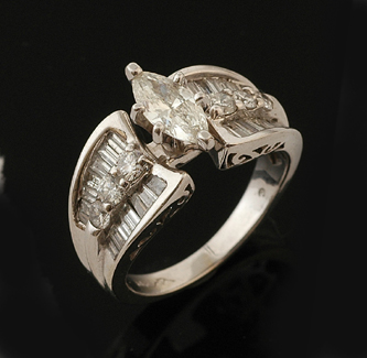 Appraisal: A diamond dress ring The principal marquise cut diamond weighing