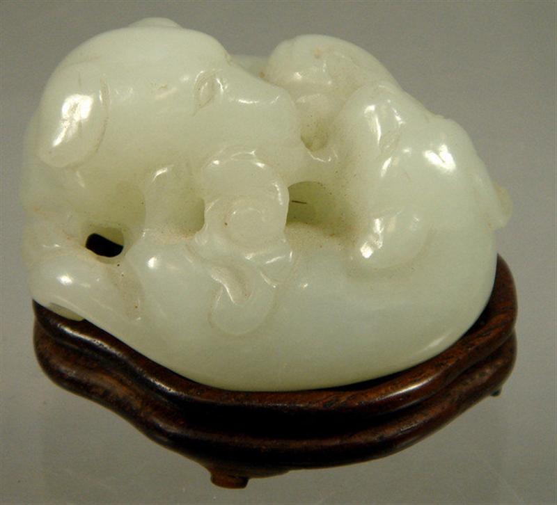 Appraisal: th th c Chinese carved jade group with dogs on