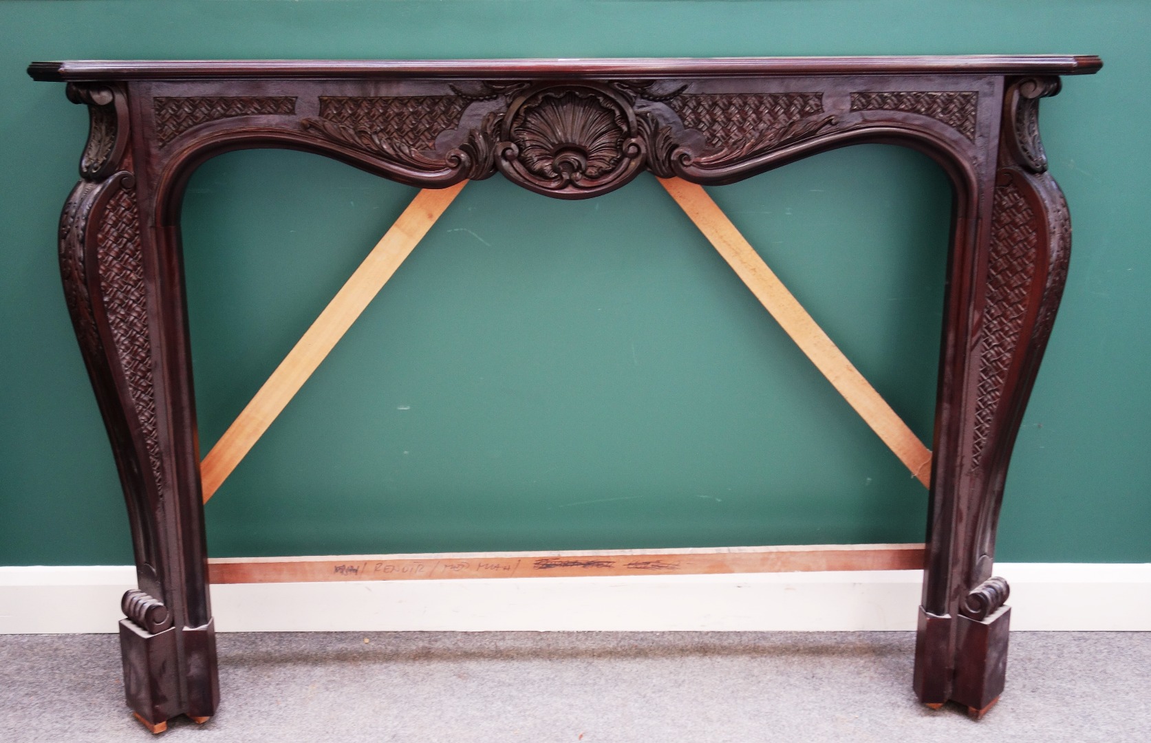 Appraisal: A mahogany fire surround of Louis XV style with shell