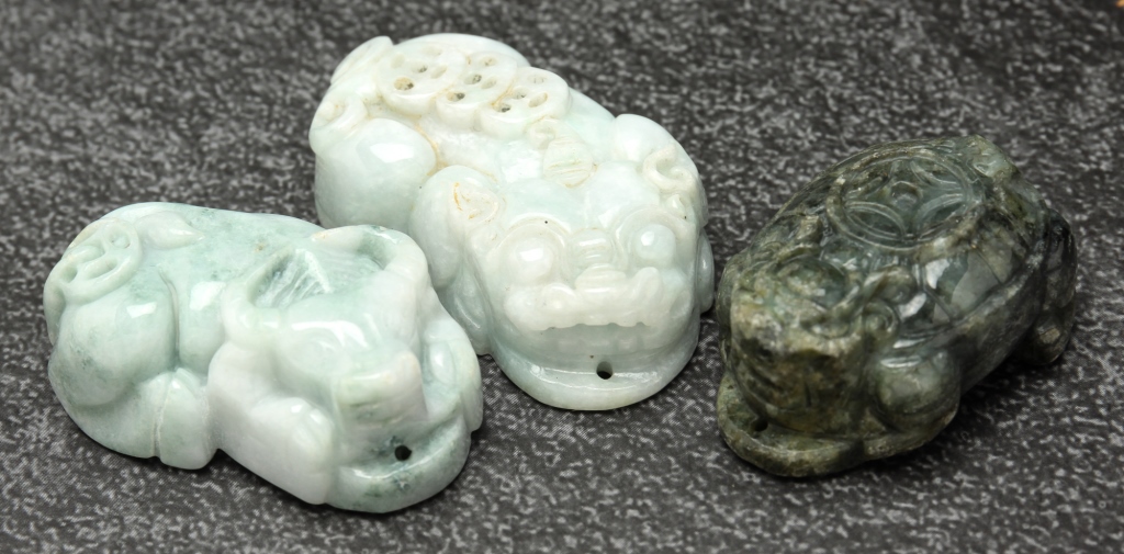 Appraisal: THREE CHINESE JADE ANIMAL PENDANTS Second half th century All