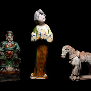 Appraisal: Three Chinese Pottery Figures comprising of a sancai glazed female